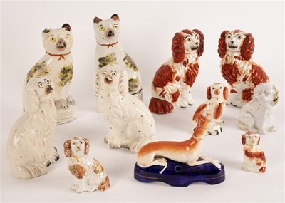 Lot 299 - A pair of pearlware figures of seated cats...