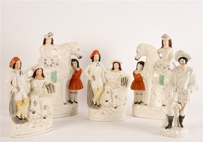 Lot 300 - A pair of Staffordshire flatback equestrian...