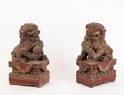 Lot 369 - A pair of Chinese carved and gilded Dogs of Fo,...