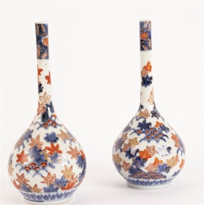Lot 373 - A pair of Japanese Imari bottle vases