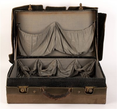 Lot 382 - A crocodile skin suitcase and four parasols,...