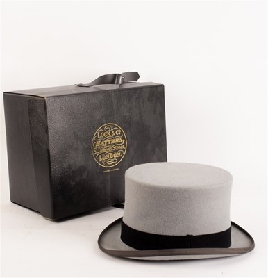 Lot 383 - A grey felt top hat, Locke& Co. in the...