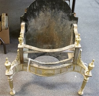 Lot 389 - A cast iron and brass fire grate of Adam...