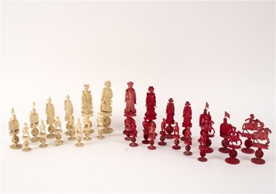 Lot 391 - A near complete set of carved and red stained...