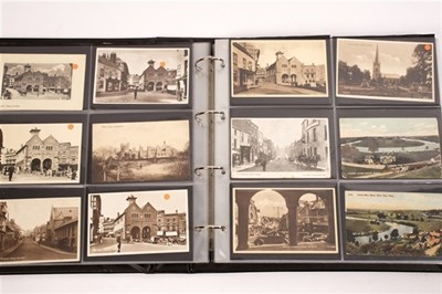 Lot 392 - A postcard album containing approximately...