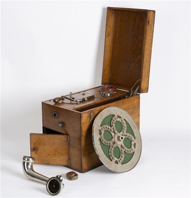Lot 403 - A Celeste Trench 4 portable gramophone in oak...