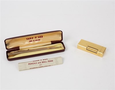 Lot 404 - A Dunhill gold plated lighter and a boxed Yard-...