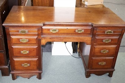 Lot 534 - An Edwardian mahogany twin-pedestal desk,...