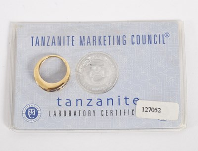 Lot 23 - A tanzanite and diamond half hoop ring, the...