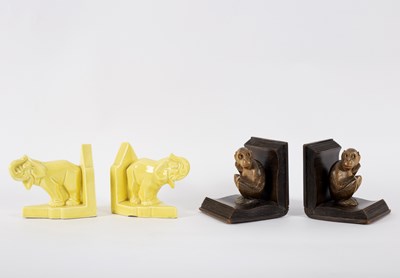 Lot 101 - A pair of wooden bookends, each carved as a...