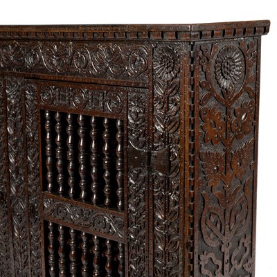 Lot 23 - A 17th Century oak hanging cupboard, with...