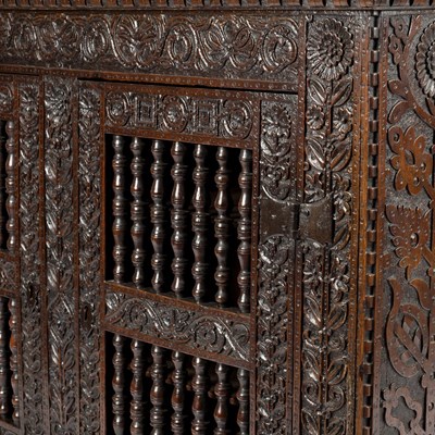 Lot 23 - A 17th Century oak hanging cupboard, with...