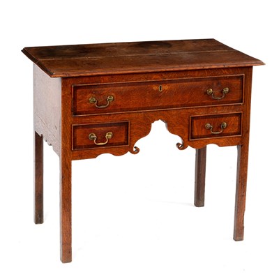 Lot 55 - An oak kneehole desk fitted three drawers on...