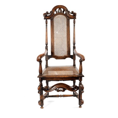 Lot 57 - A walnut armchair of Carolean design with cane...