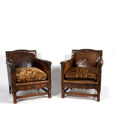 Lot 74 - A leather sofa and two matching armchairs