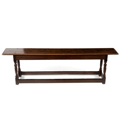 Lot 77 - A late 17th Century oak long bench, stamped RT...