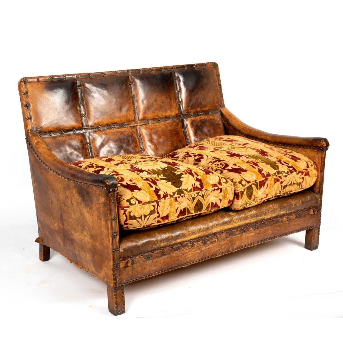 Lot 83 - A leather two-seater sofa