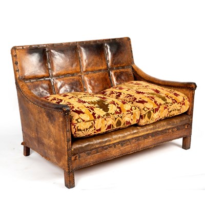 Lot 83 - A leather two-seater sofa