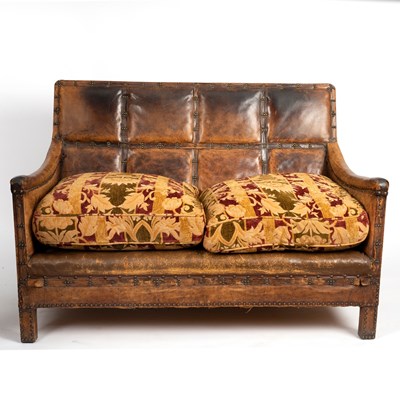 Lot 83 - A leather two-seater sofa