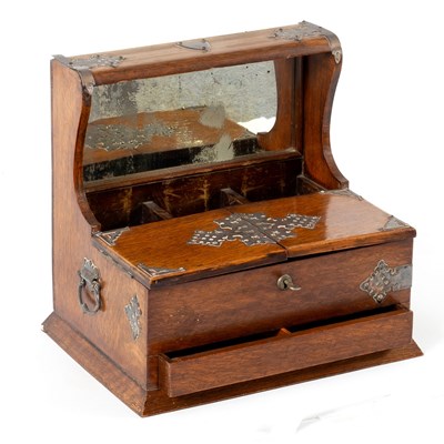 Lot 86 - An Edwardian oak tantalus (lacking decanters),...