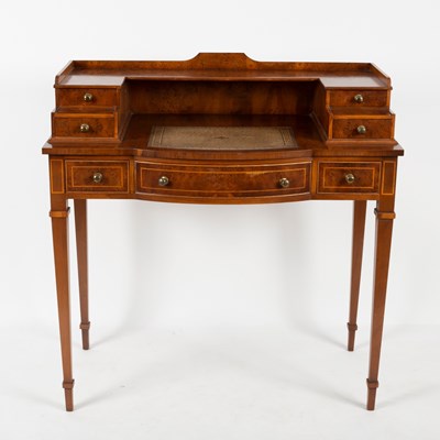 Lot 95 - A reproduction bonheur-du-jour, in mahogany...