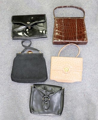 Lot 605 - A crocodile skin hand bag, The Martin, brass...