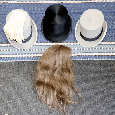 Lot 607 - Three Dunn and Co. top hats, boxed, a wig and...