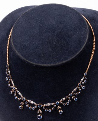 Lot 121 - An Edwardian yellow gold, diamond and sapphire collarette necklace