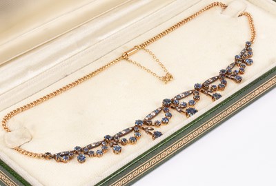 Lot 121 - An Edwardian yellow gold, diamond and sapphire collarette necklace