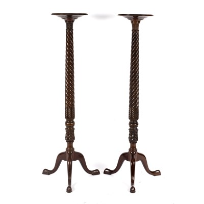 Lot 691 - A pair of George III style mahogany tripod...