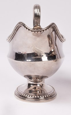 Lot 165 - A pair of George III silver sauce boats