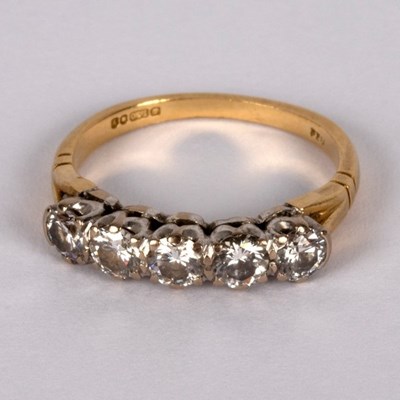 Lot 5 - A diamond five-stone ring, claw set in white...