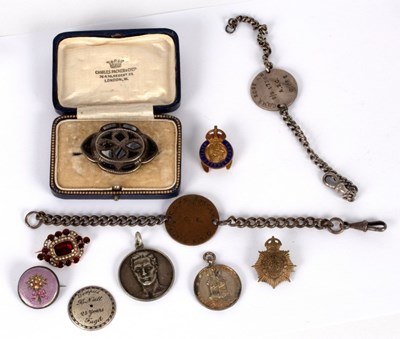 Lot 7 - A 19th Century garnet and seed pearl brooch,...