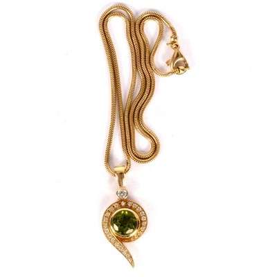 Lot 21 - A peridot and diamond pendant by Catherine...
