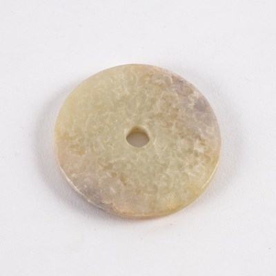 Lot 291 - A Chinese white jade bi disc carved with...