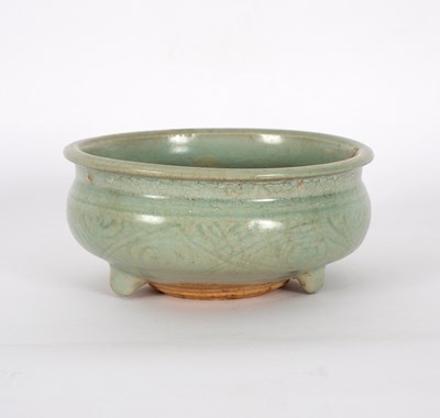 Lot 300 - A celadon glaze censer, incised, on three feet,...