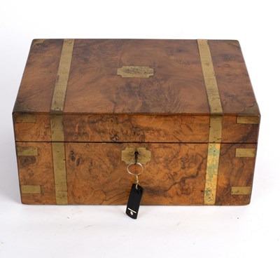 Lot 395 - A Victorian walnut brass bound writing box...