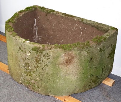 Lot 505 - A large D-shaped stone trough, 98cm x 74cm