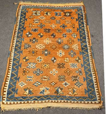Lot 736 - A Moroccan rug, modern copper red gul field,...