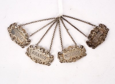 Lot 118 - A set of four silver spirit labels, Richard...