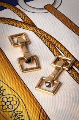 Lot 94 - A pair of Cartier yellow metal and sapphire cufflinks