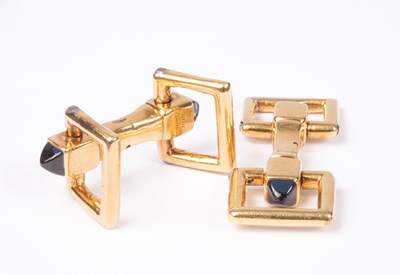 Lot 94 - A pair of Cartier yellow metal and sapphire cufflinks