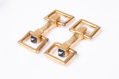 Lot 94 - A pair of Cartier yellow metal and sapphire cufflinks