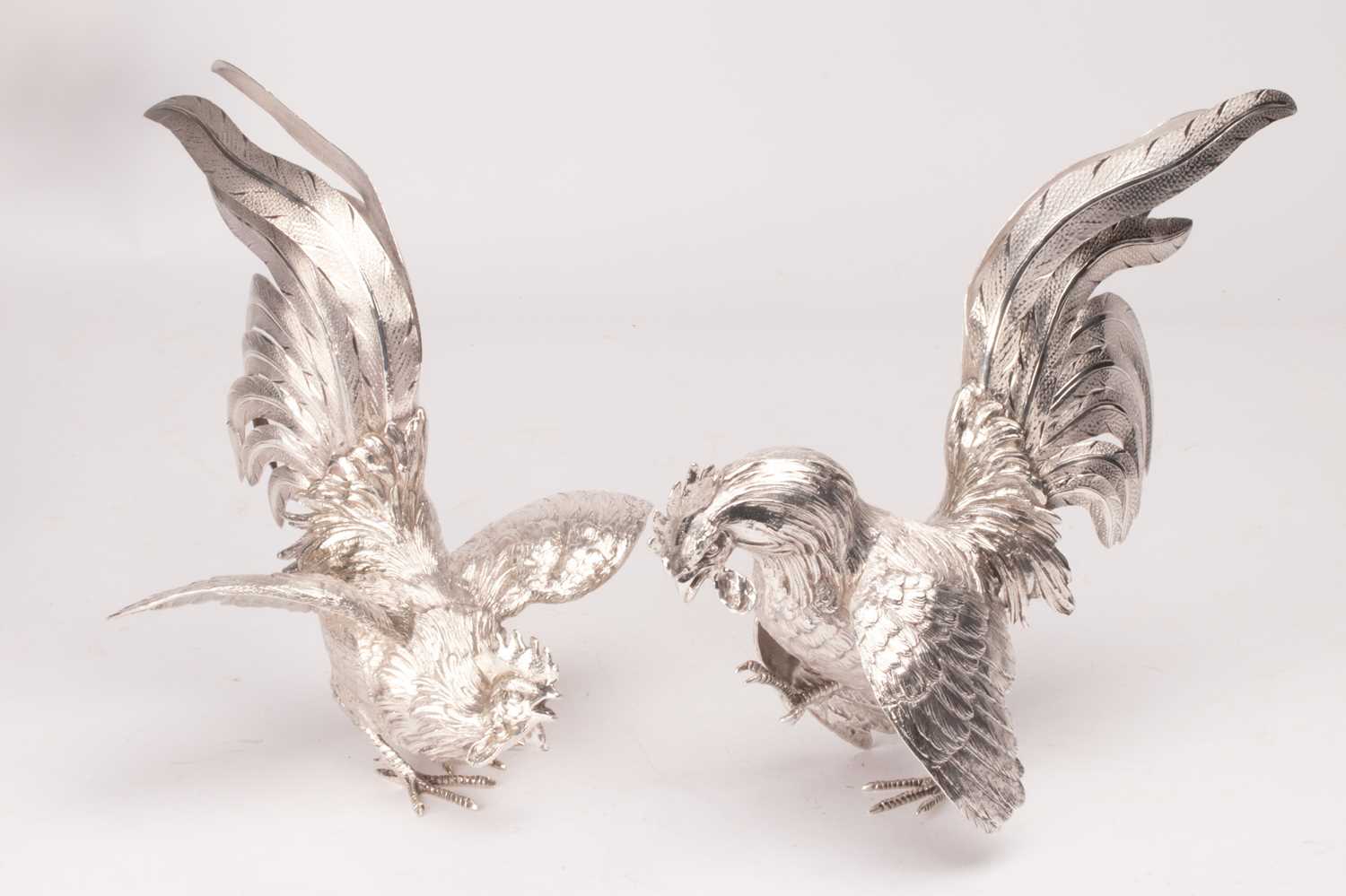 Lot 164 - Two silver table cockerels