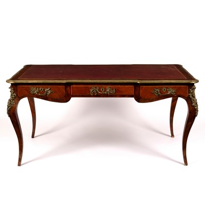 Lot 758 - A Louis XVI style bureau plat with gilt metal...