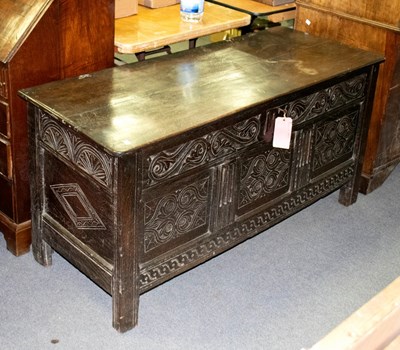 Lot 326 - An 18th Century carved oak coffer with plain...