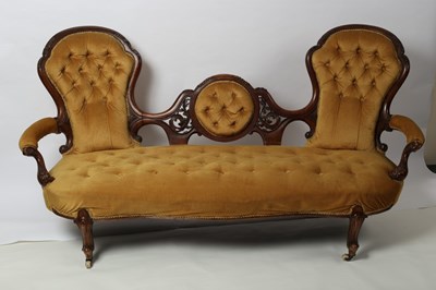 Lot 336 - A Victorian walnut two chair back settee, the...