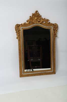 Lot 342 - A decorative gilt framed wall mirror with...