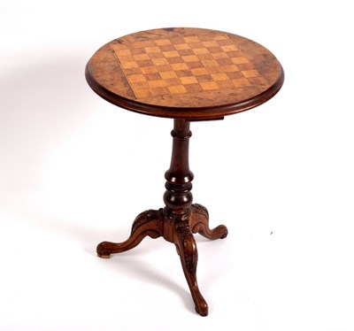 Lot 378 - A Victorian walnut tripod games table, circa...