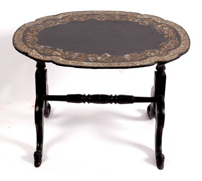 Lot 379 - A black japanned trestle table, circa 1870,...